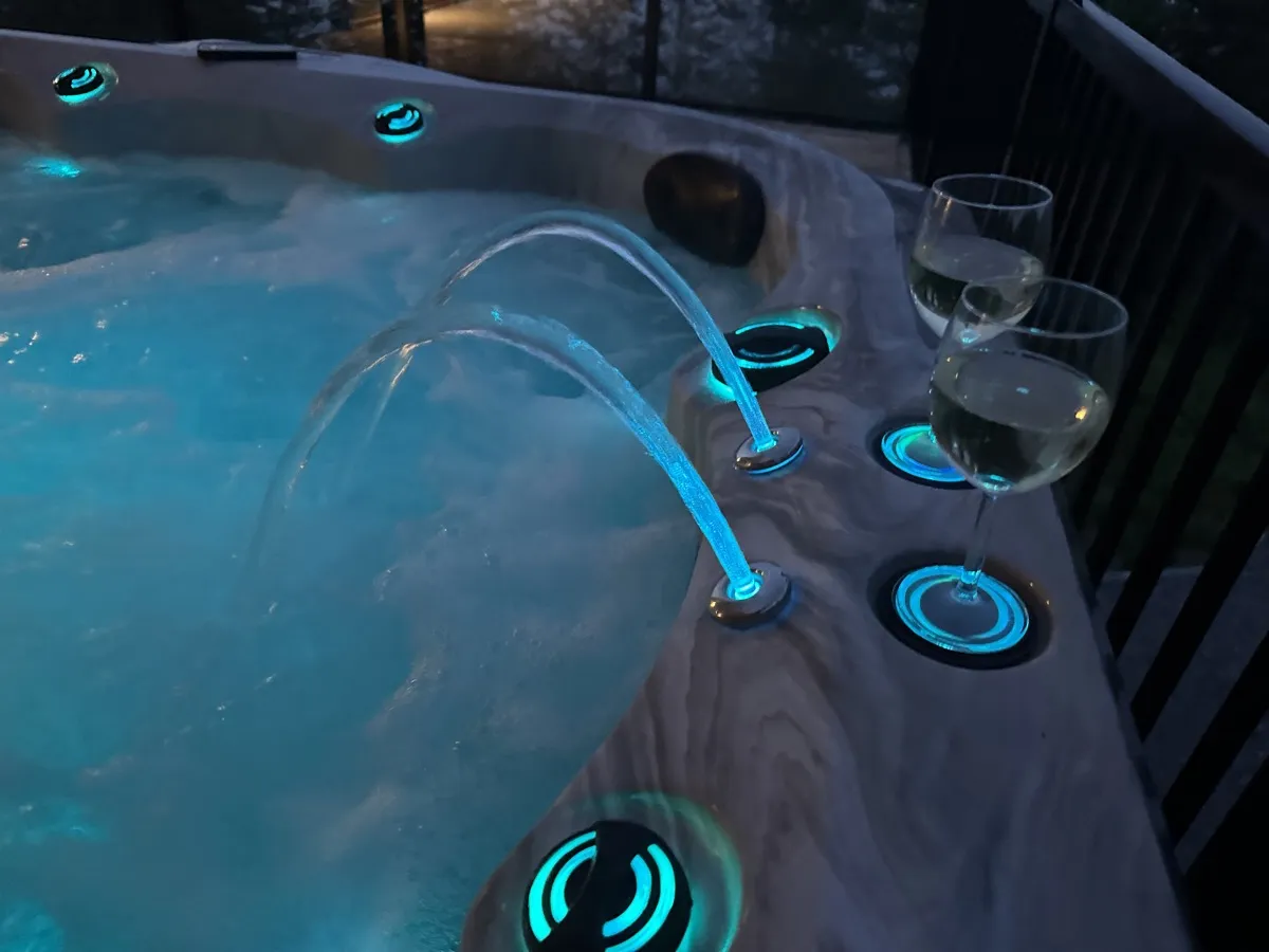Thermēa spa at night with blue LED waterfalls and ambient lighting