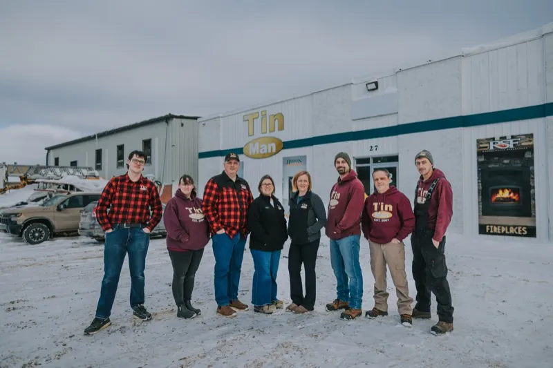 The Tin Man team standing in front of their Corner Brook showroom